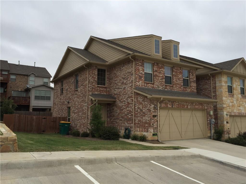 a front view of a house with a garage