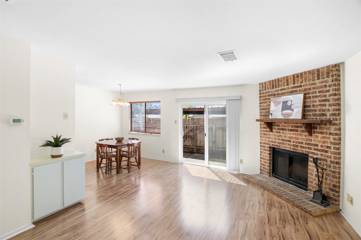 a view of a livingroom with furniture and a fireplace