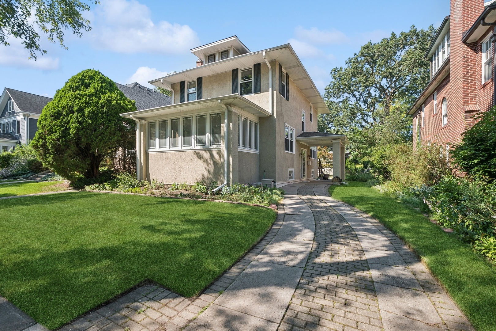 a front view of a house with garden