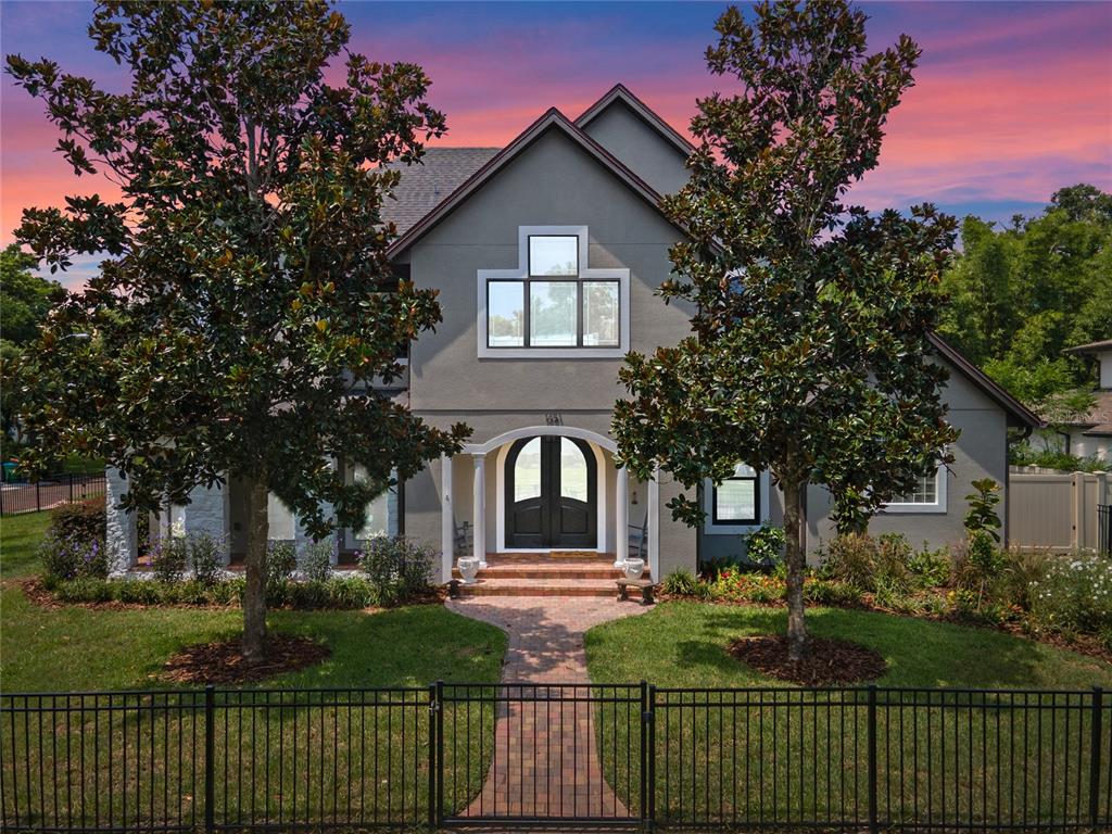 a front view of a house with garden