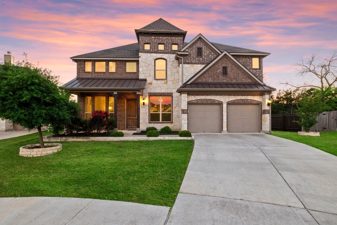 front view of a house with a yard