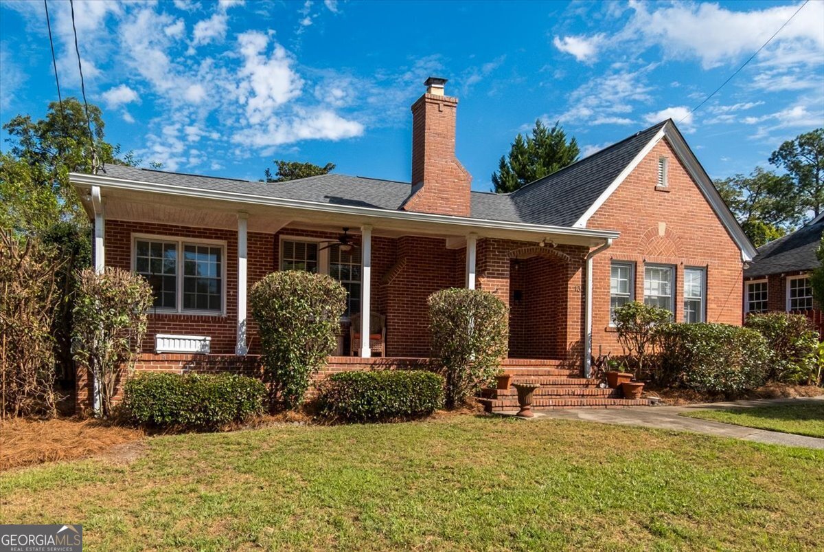 front view of a house with a yard