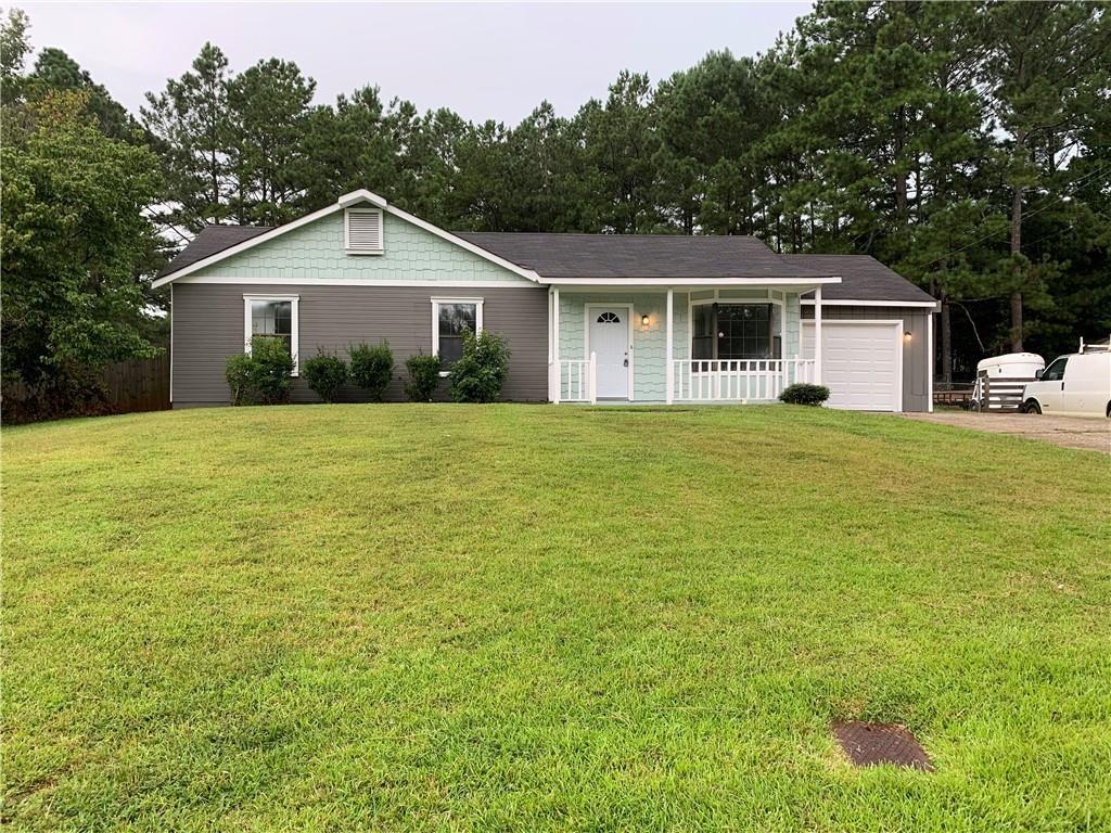 a front view of a house with yard