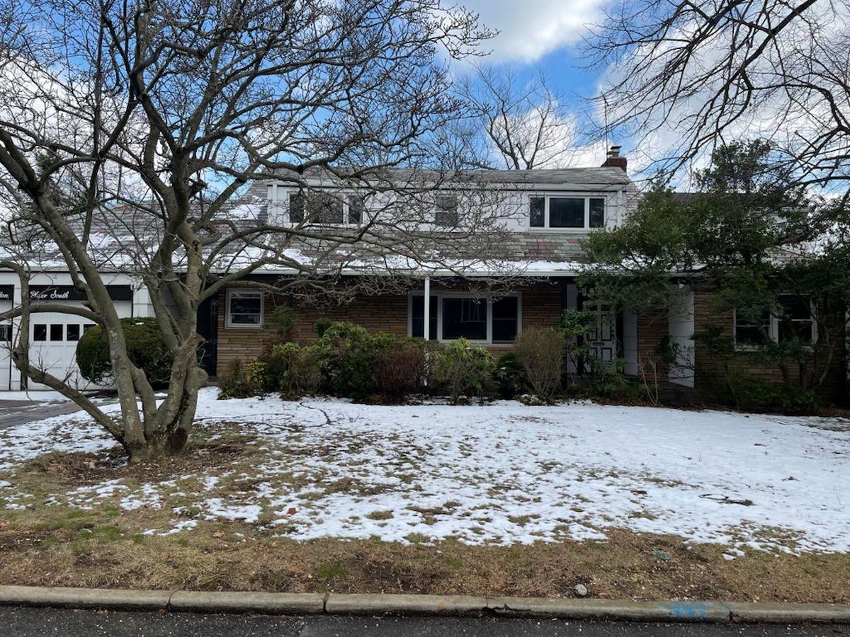 View of front of property with a garage