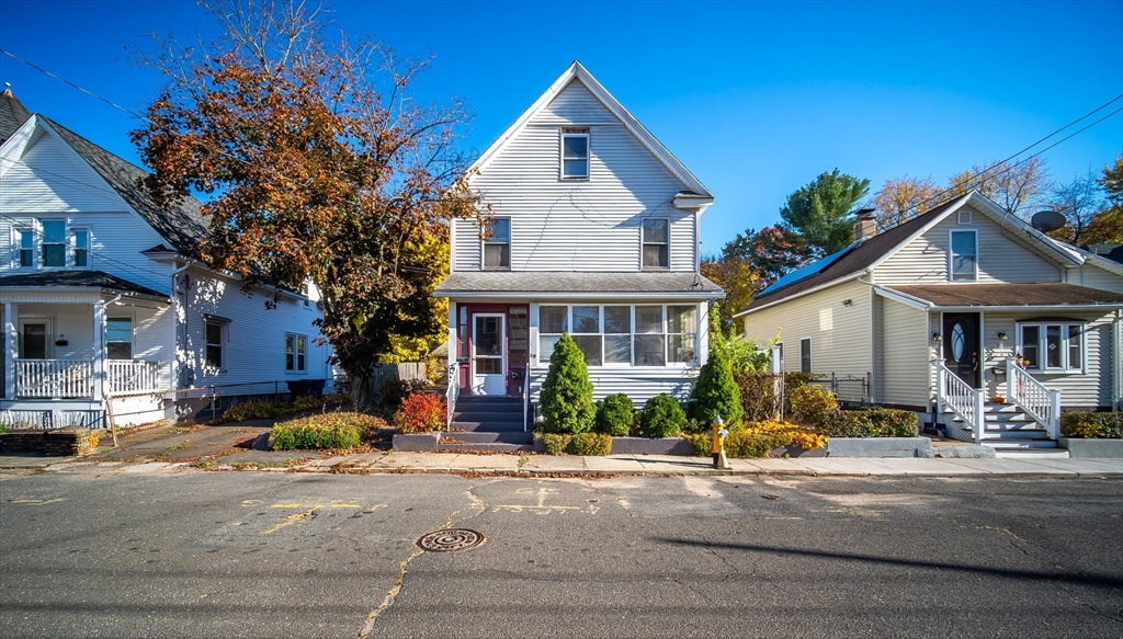 a front view of a house with a yard