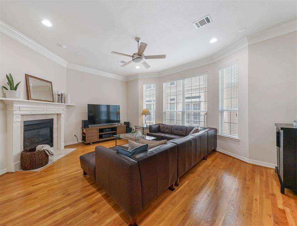 2nd floor family room features a corner fireplace and 10' ceilings.