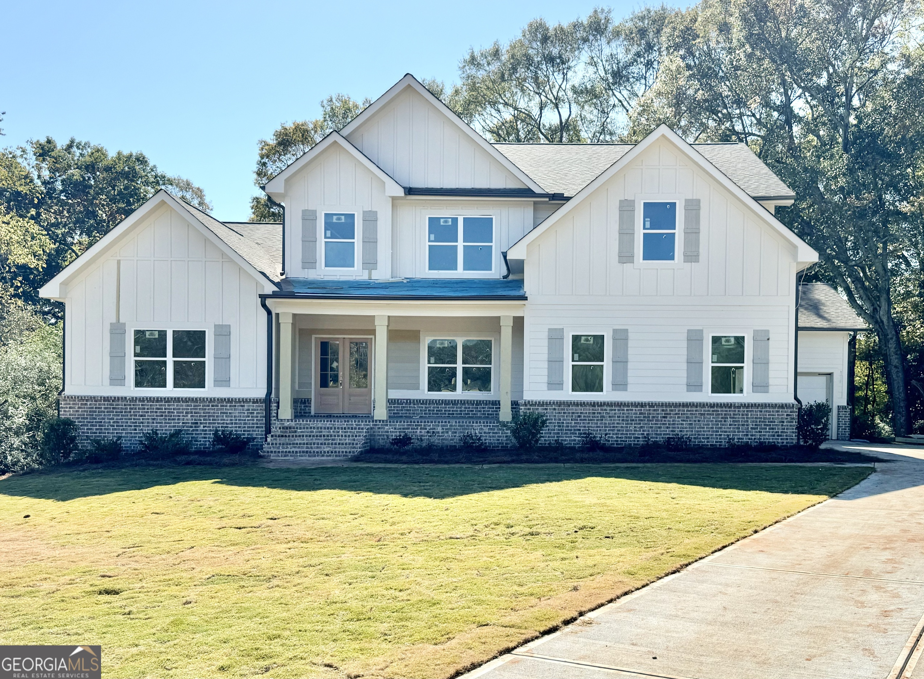 a front view of a house with a yard