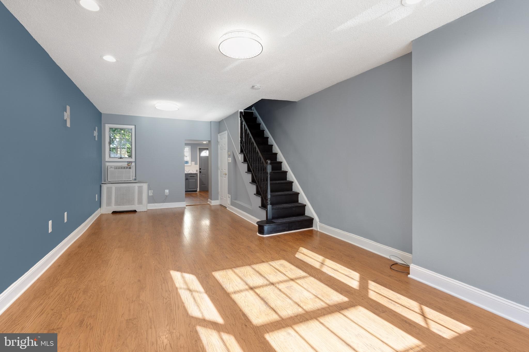 a view of an empty room with stairs