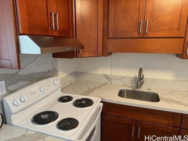 a kitchen with a stove and a sink