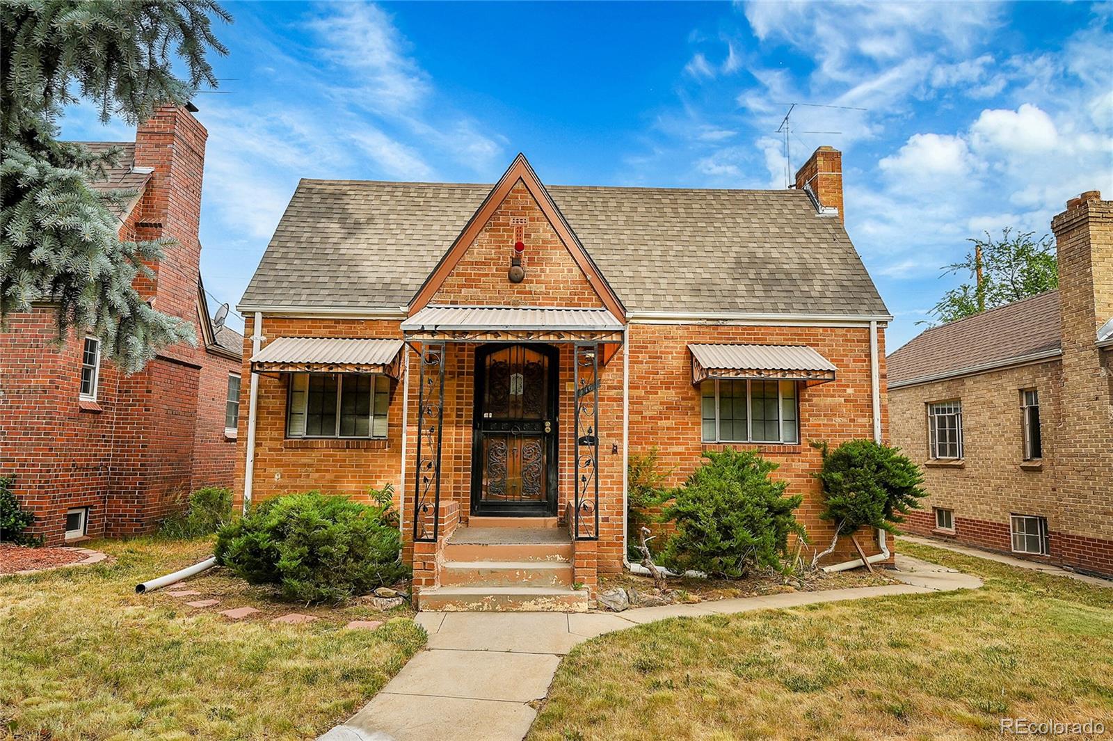 front view of a house with a yard