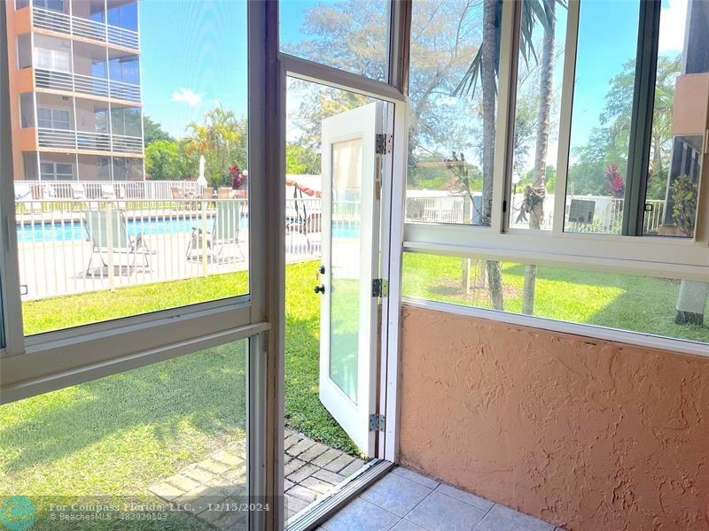 Newly enclosed patio, with impact windows and door