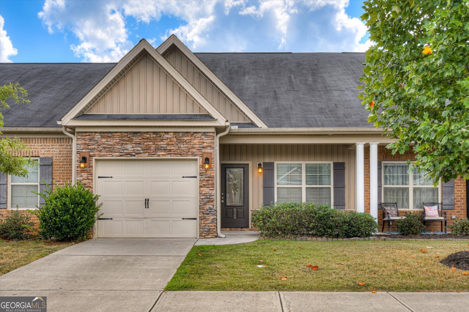 front view of a house with a yard