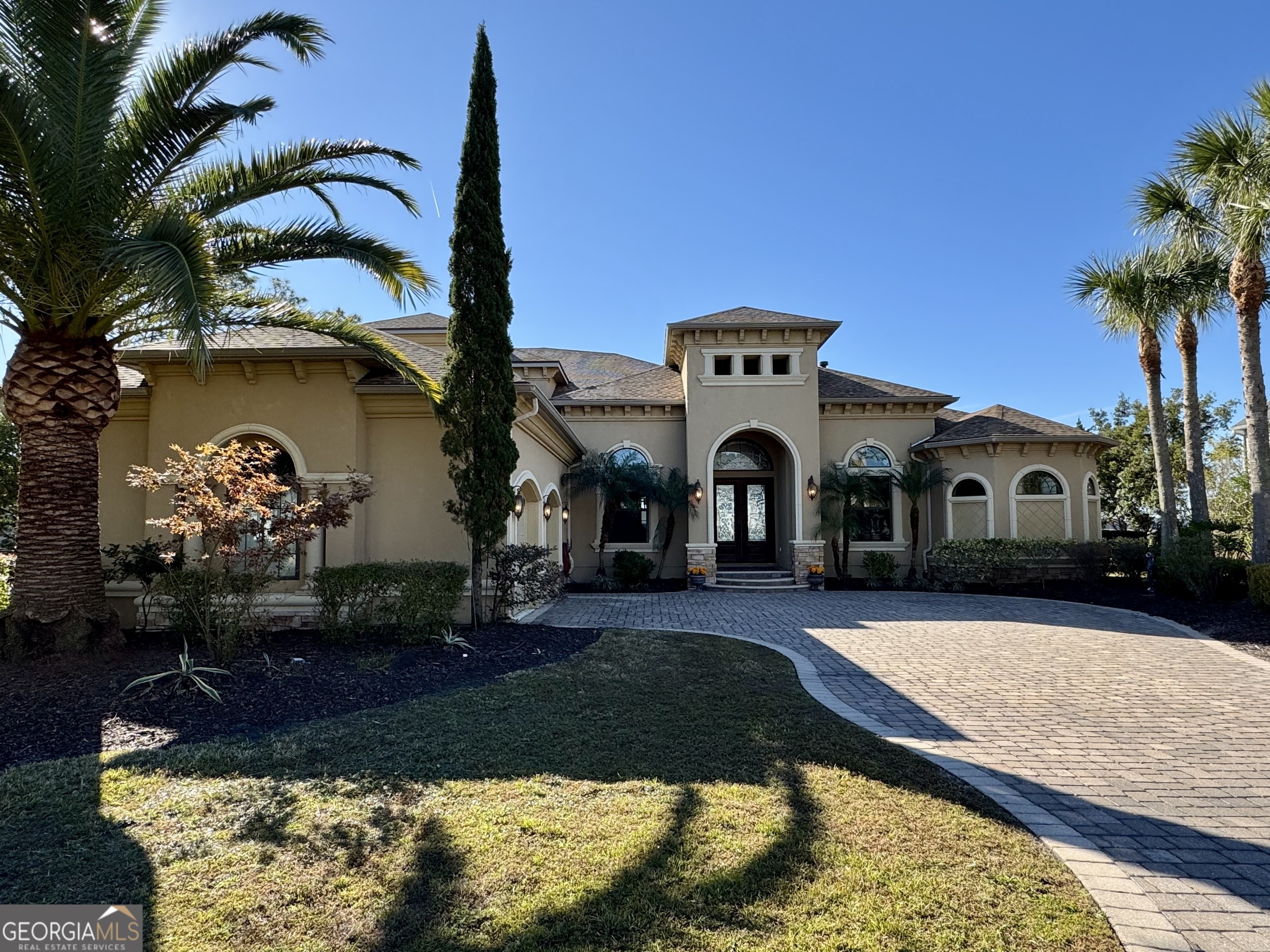 a front view of a house with garden