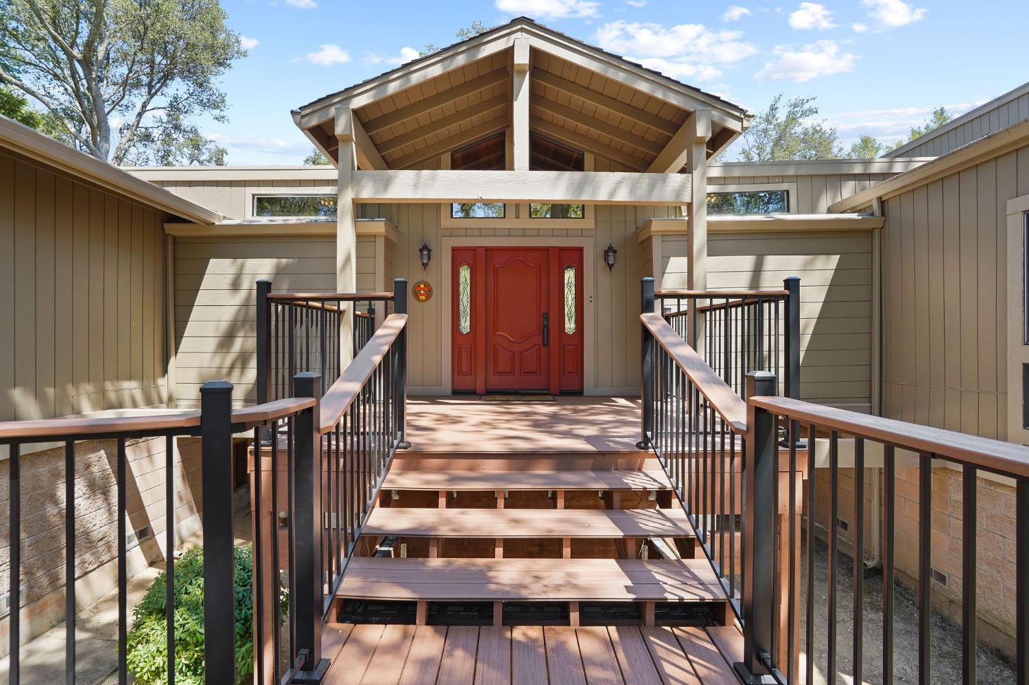 a view of a balcony with door and wooden floor