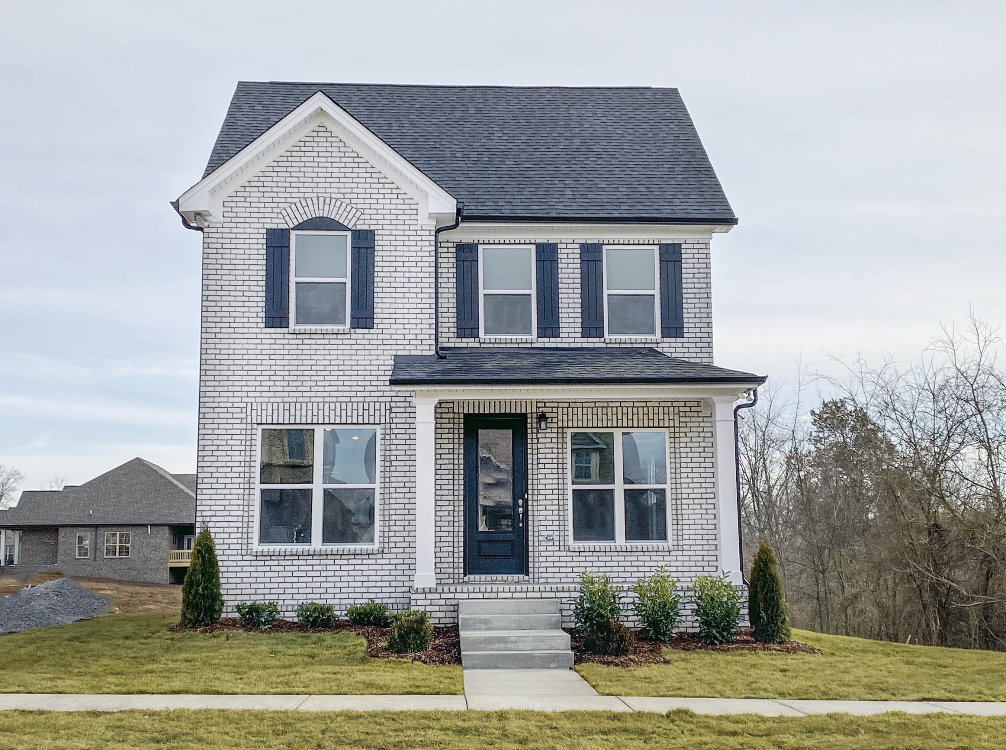 front view of a house with a yard