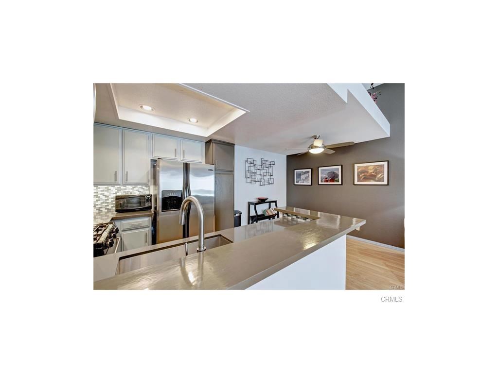 a view of a living room with kitchen island