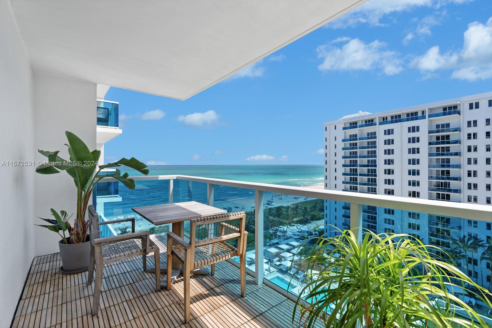 a view of a balcony with furniture