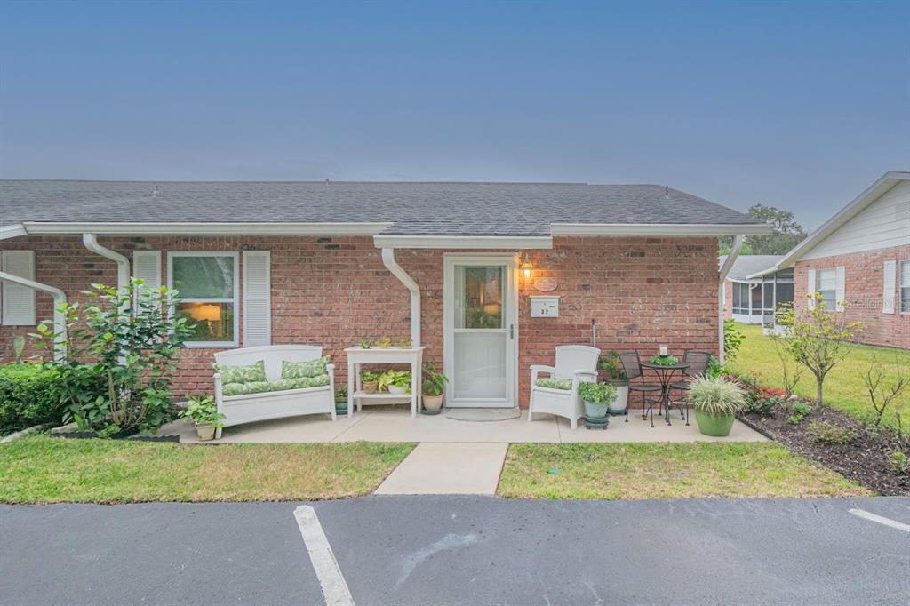 a view of house with outdoor space and porch