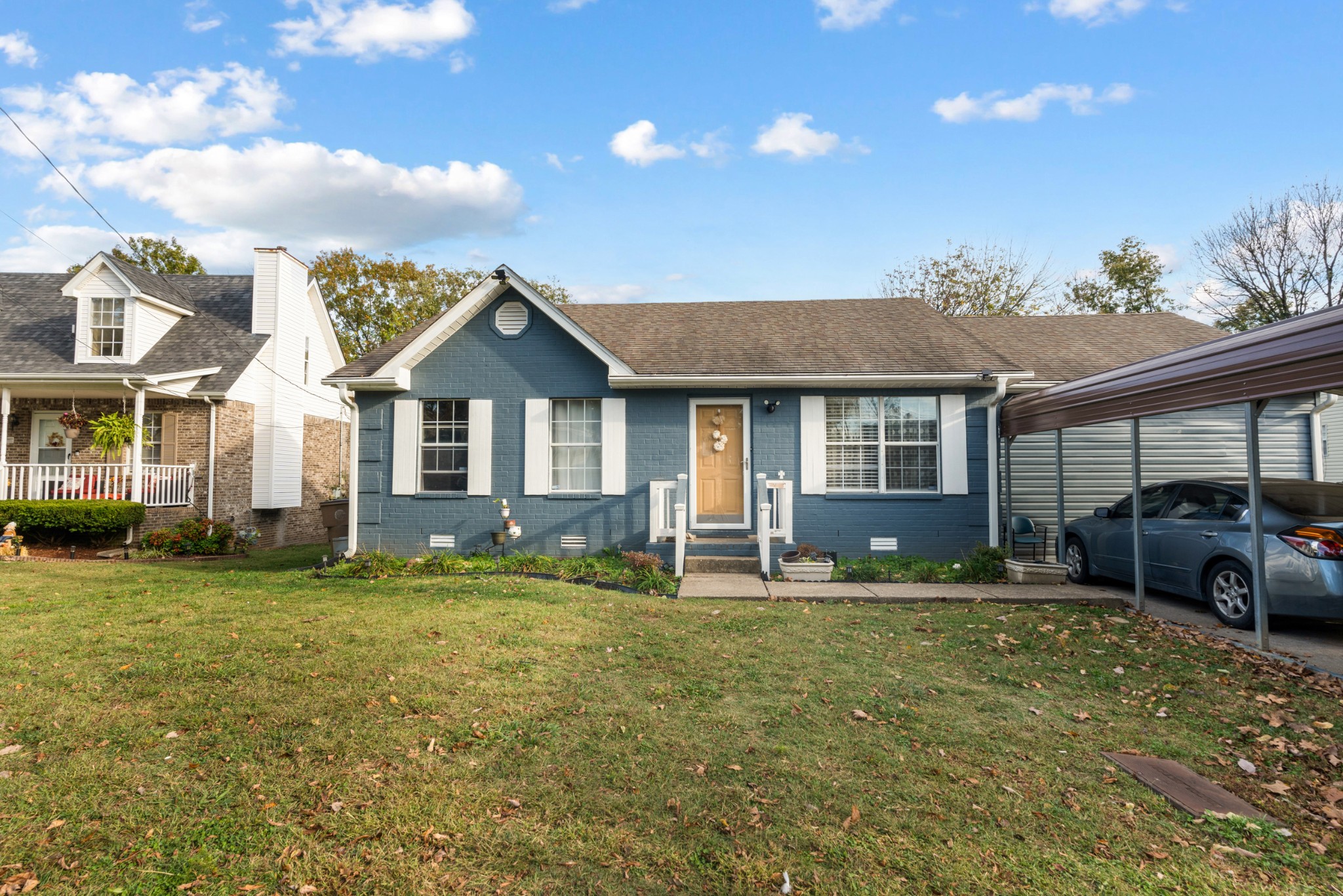 a front view of a house with a yard