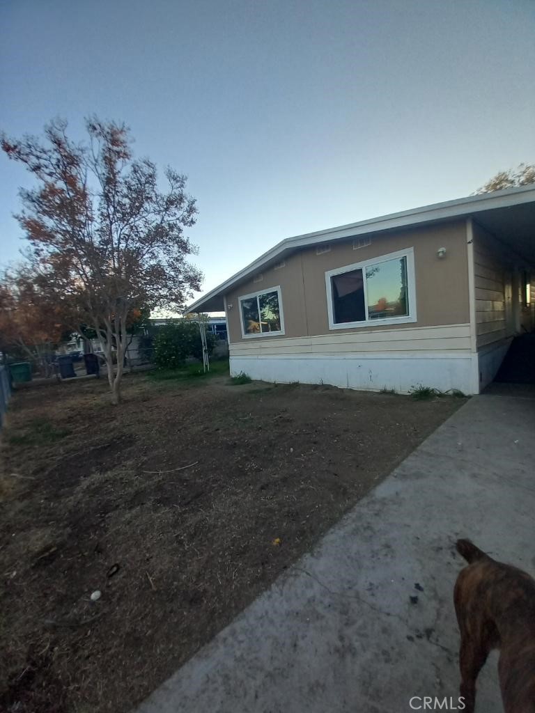 a house view with a backyard space