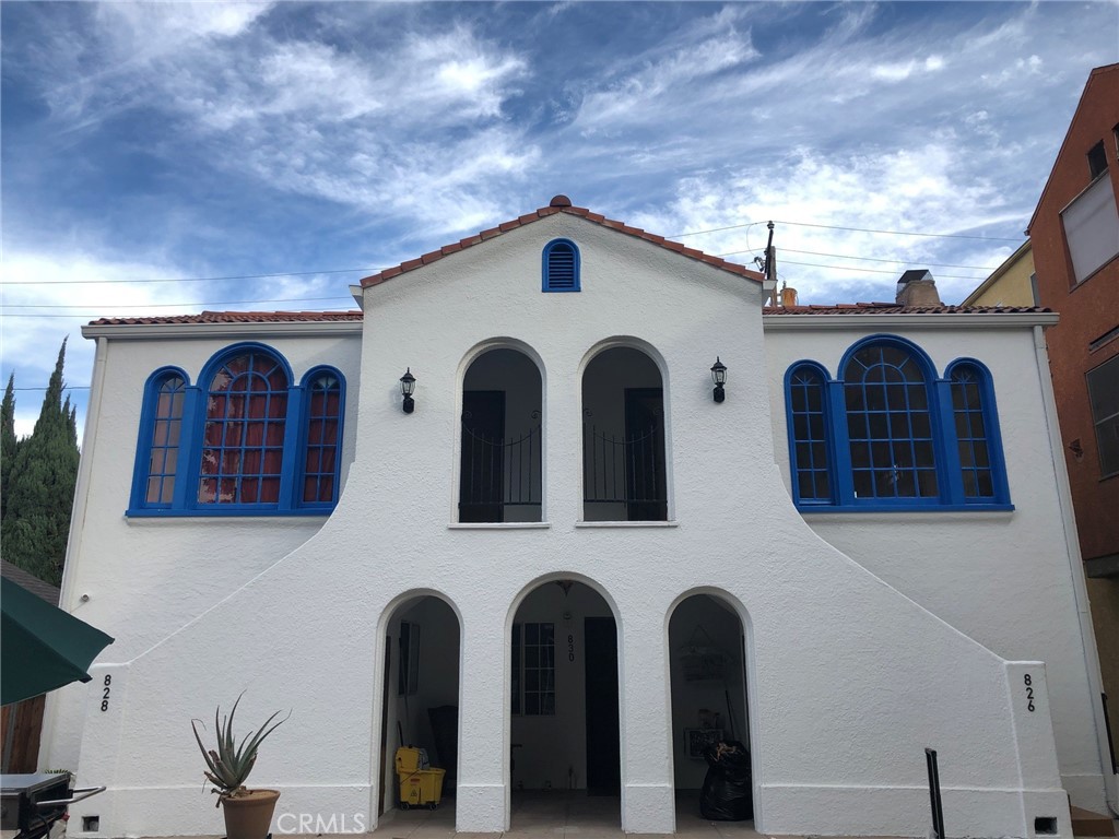 a view of a house with large windows