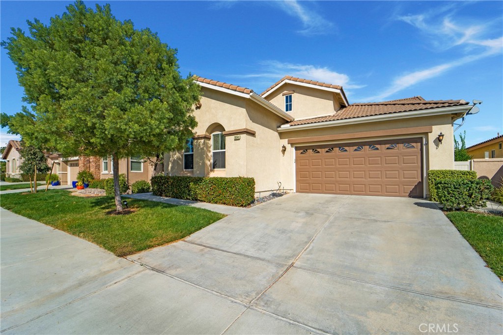 a front view of a house with yard