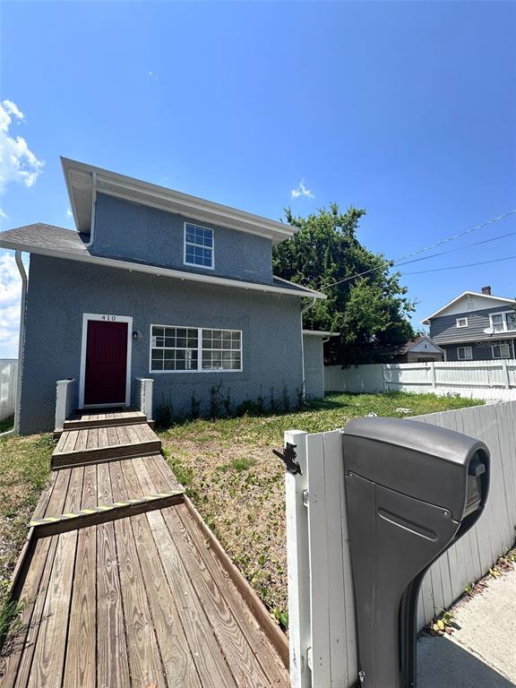 a view of house with yard entertaining space