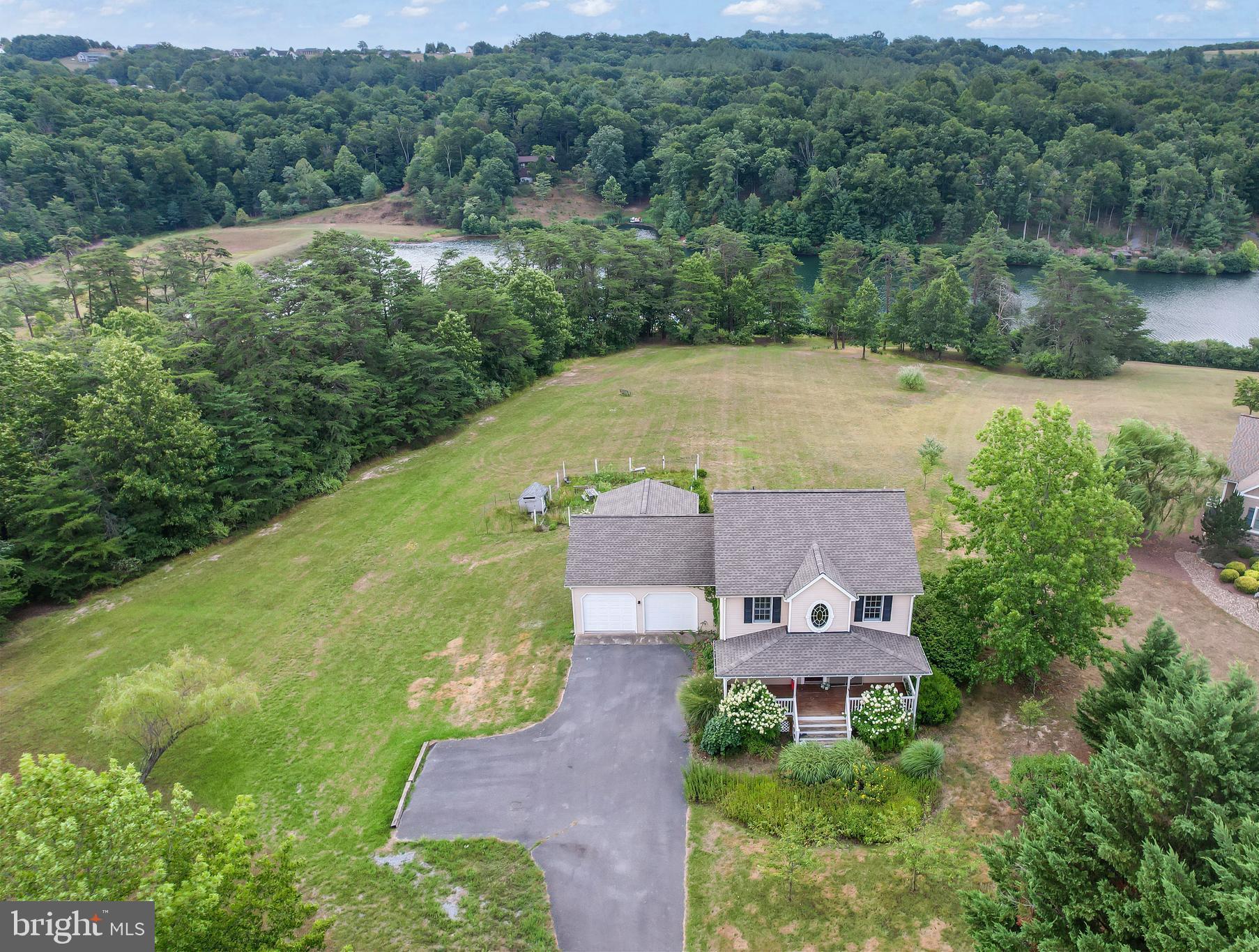 an aerial view of a house with a garden