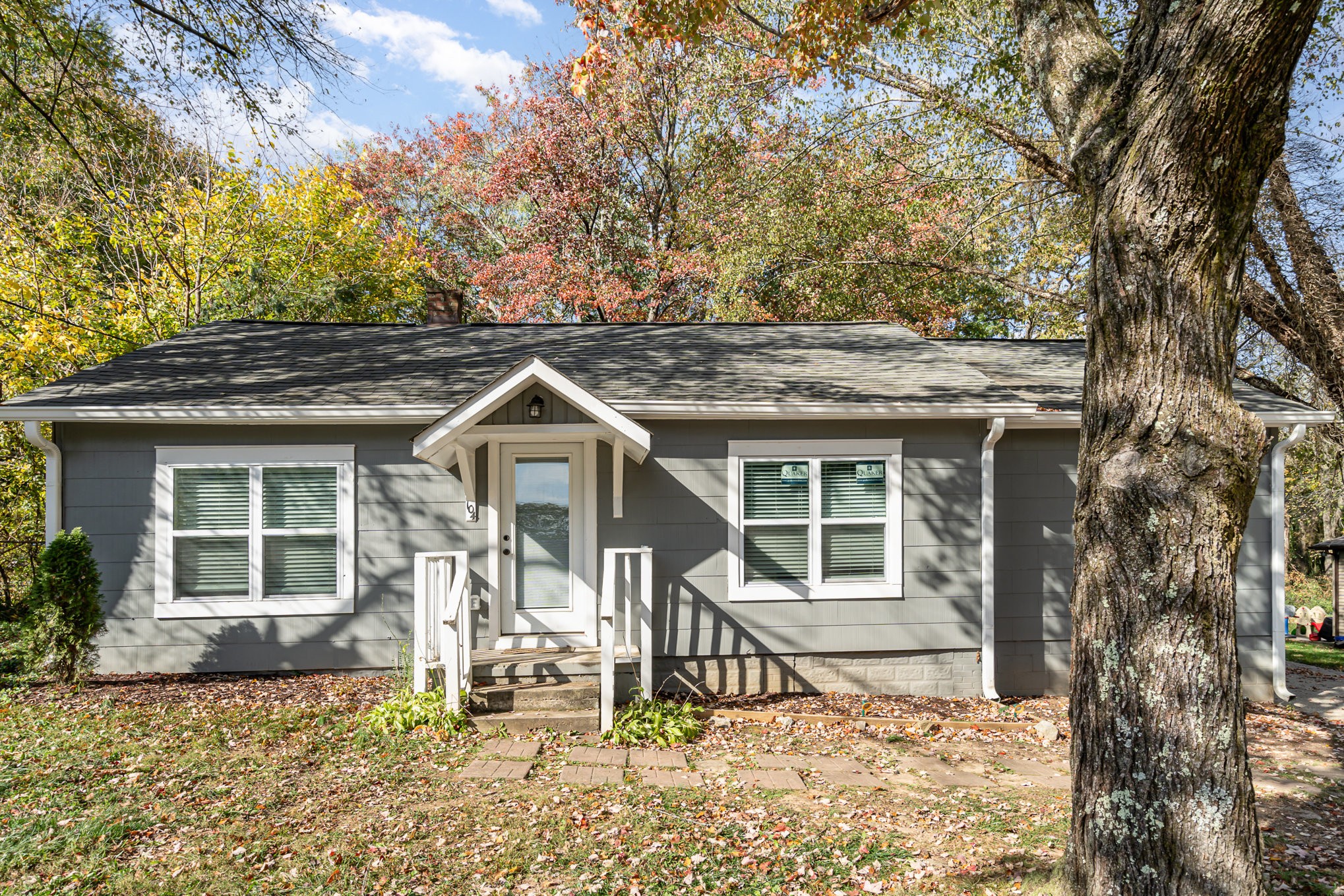 a house with trees in front of it