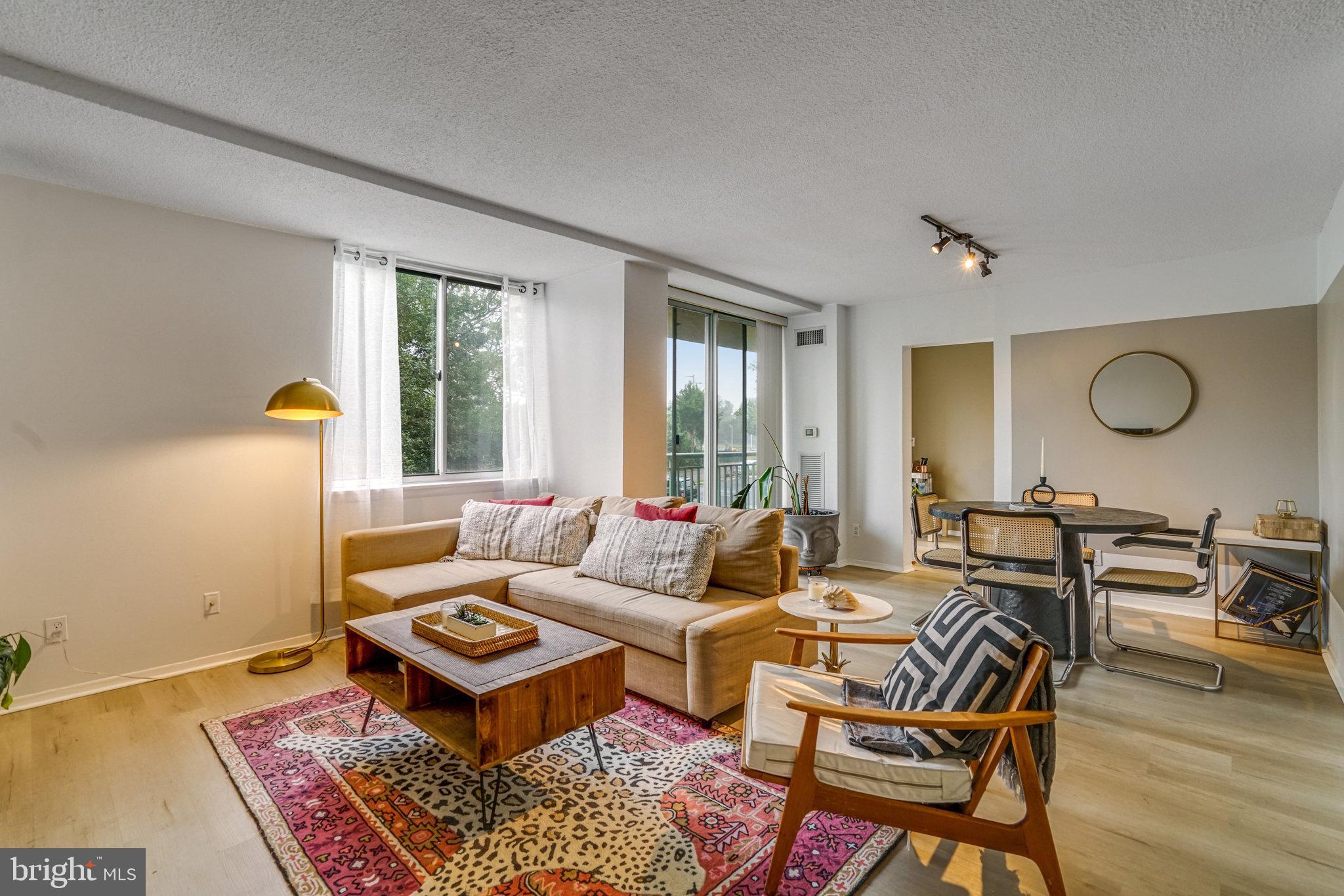 a living room with furniture and a rug