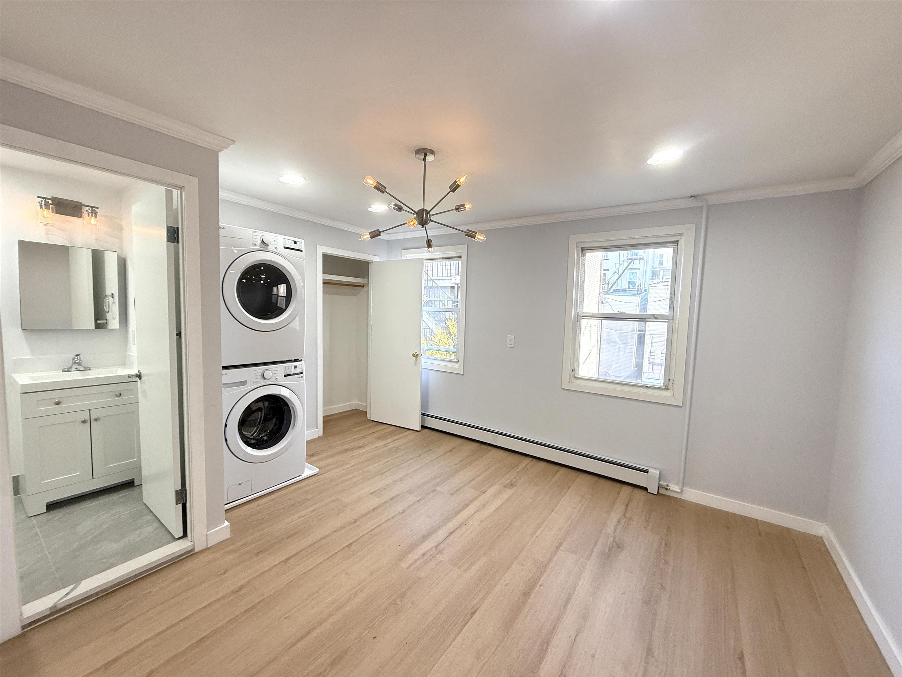 a view of a storage & utility room with washer and dryer