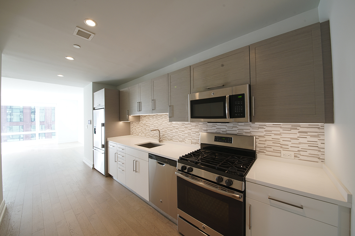 a kitchen with a stove and a microwave