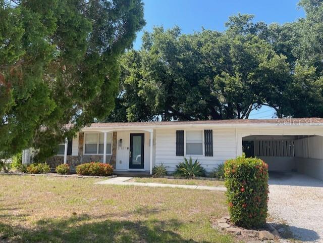 front view of a house with a yard