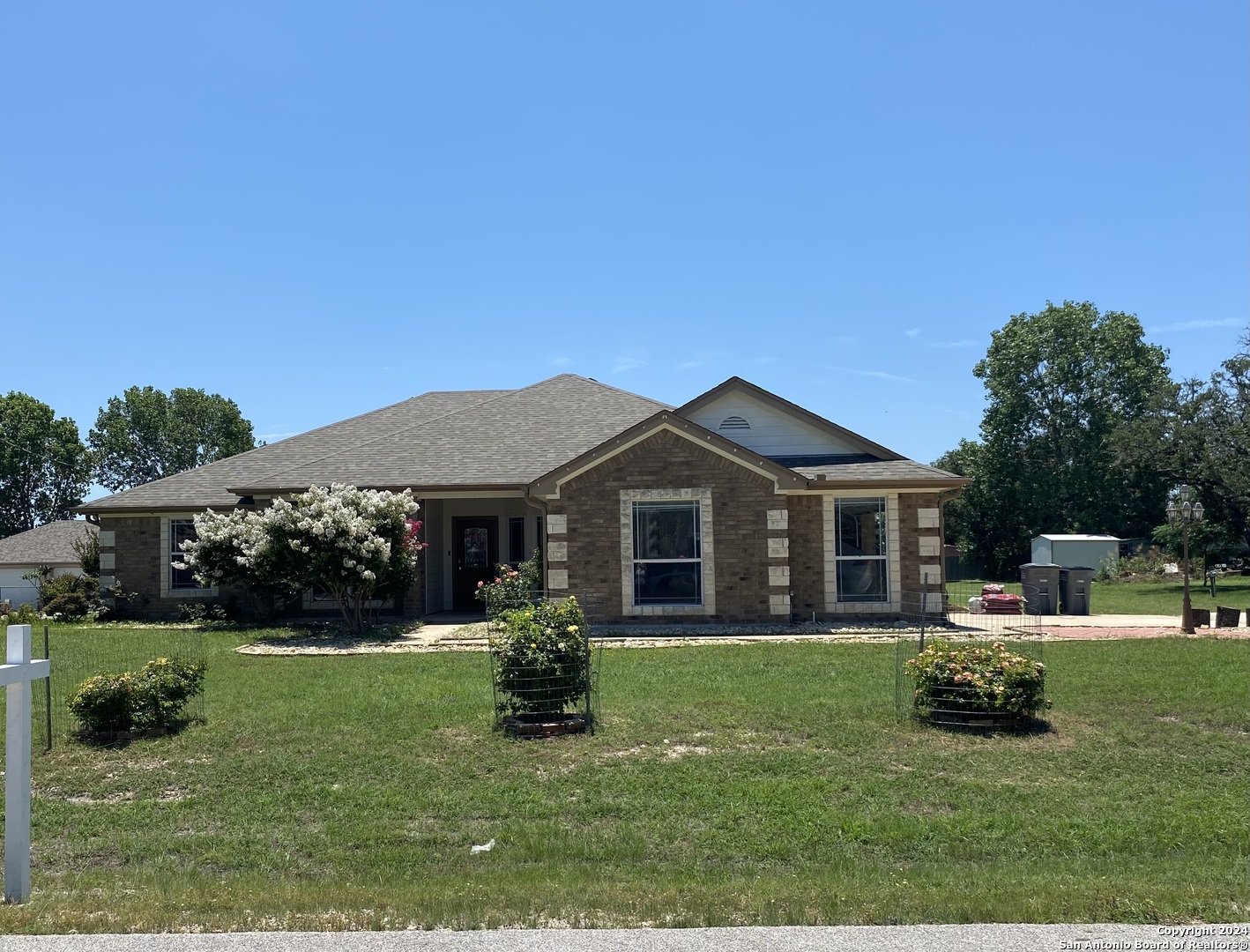 a view of a house with a yard porch and sitting area