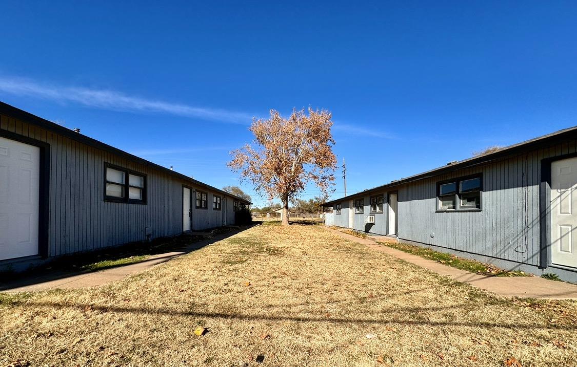 a very nice looking house with a yard