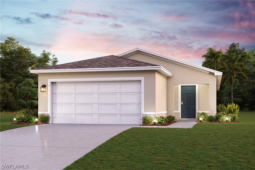 front view of a house with a yard and garage