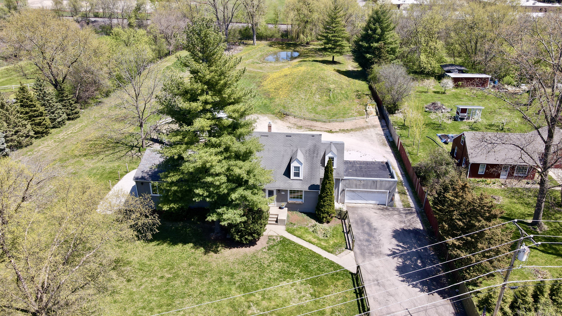 an aerial view of house with yard