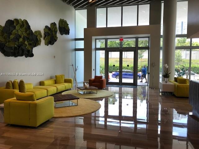 a living room with furniture and a large window