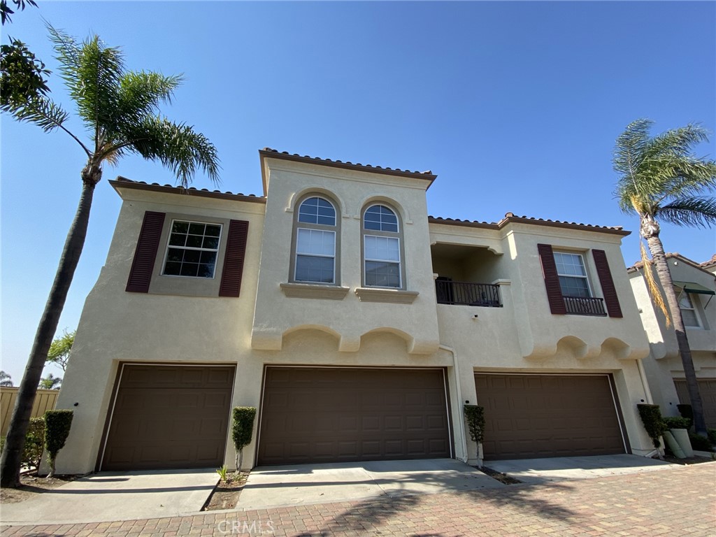 a front view of a house with garage