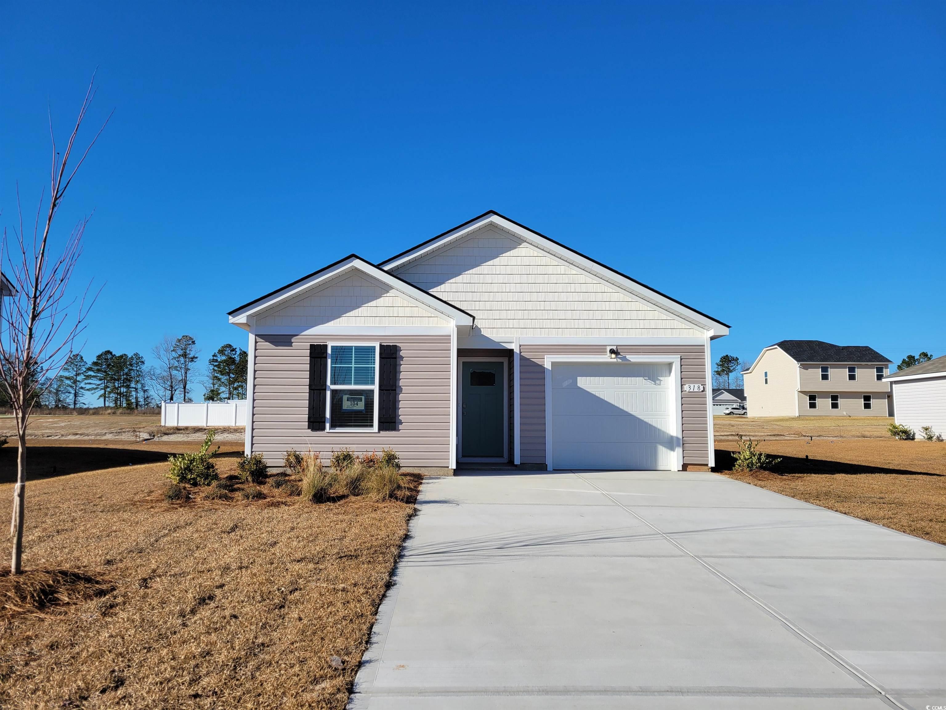 View of front facade with a garage