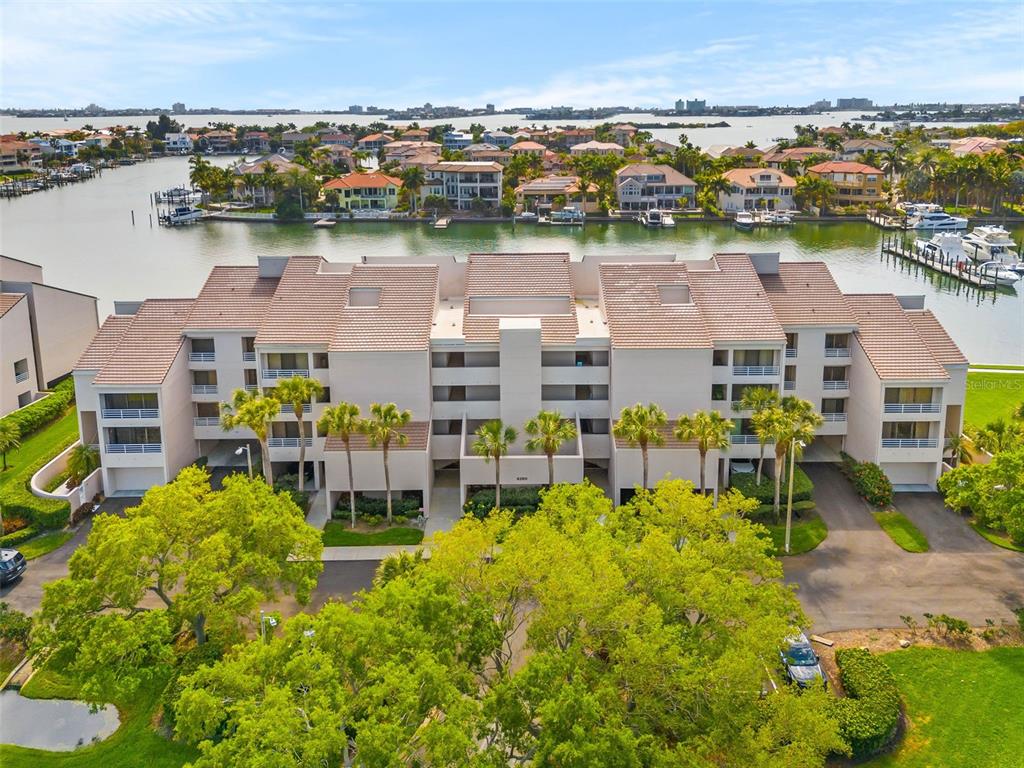 an aerial view of a house with a lake view