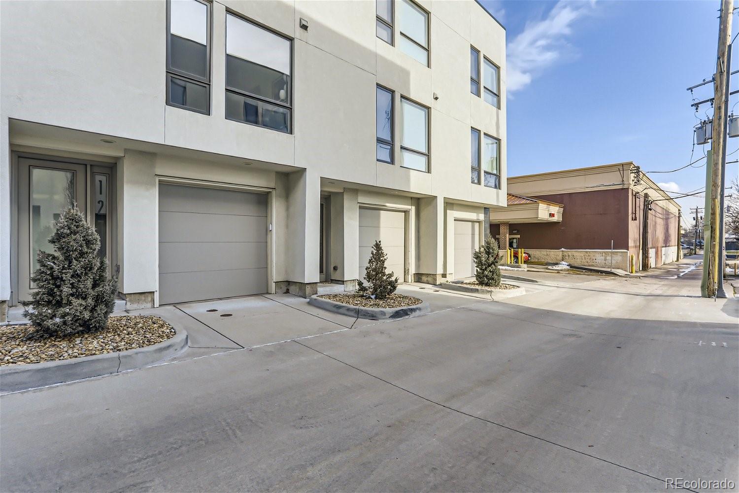 a view of a building with car parked