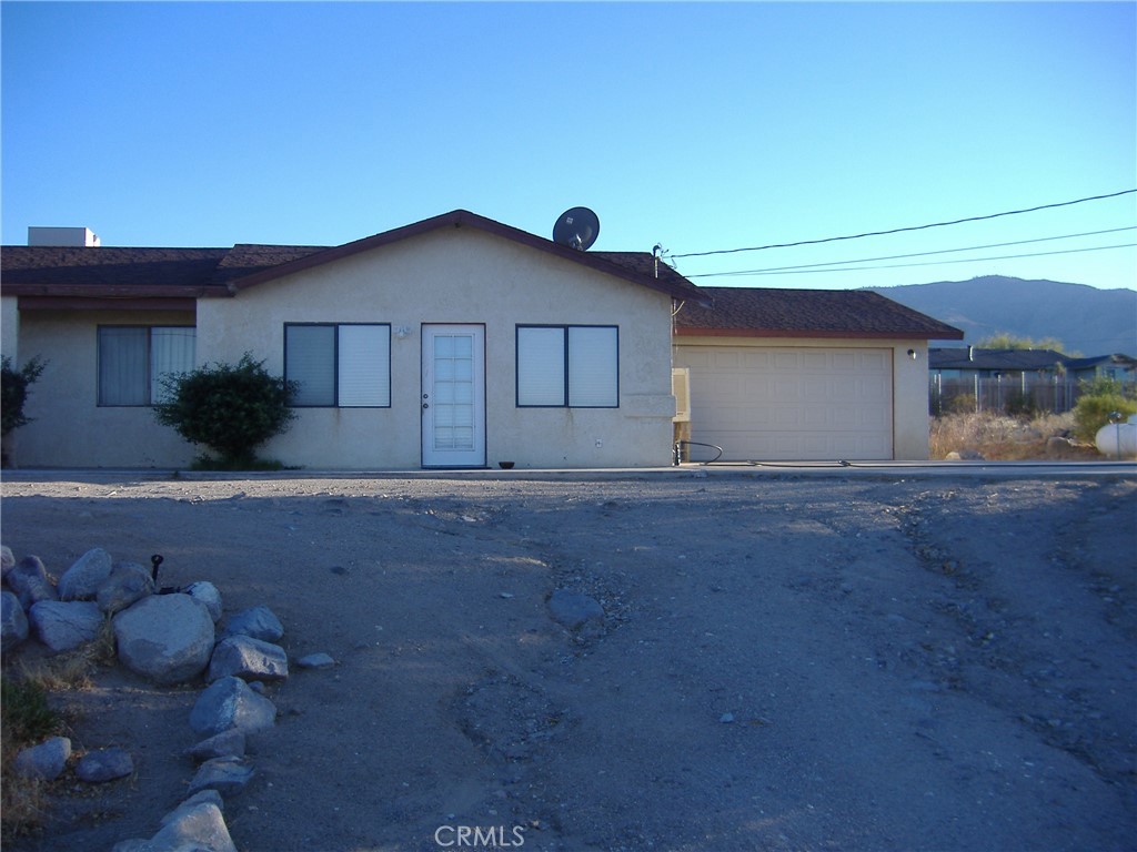 a view of house with yard