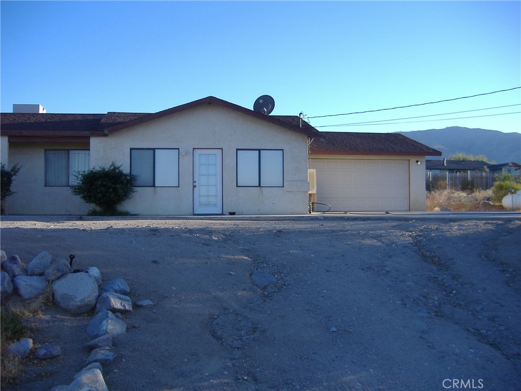 a view of house with yard