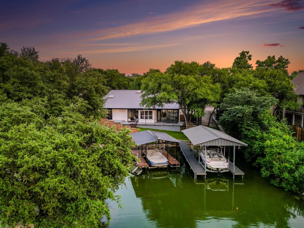 a aerial view of a house with swimming pool and a yard