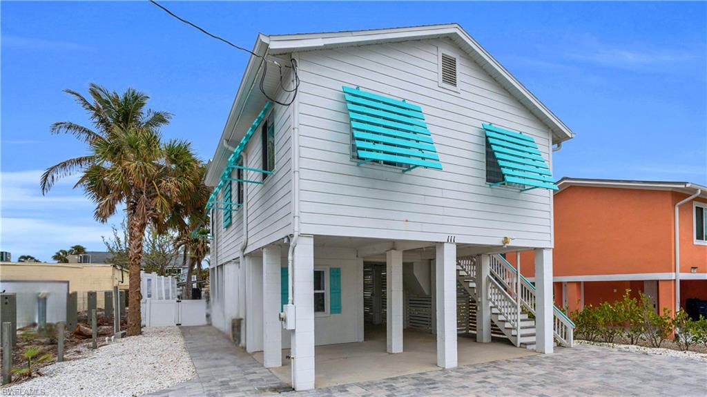 View of front of home featuring a carport