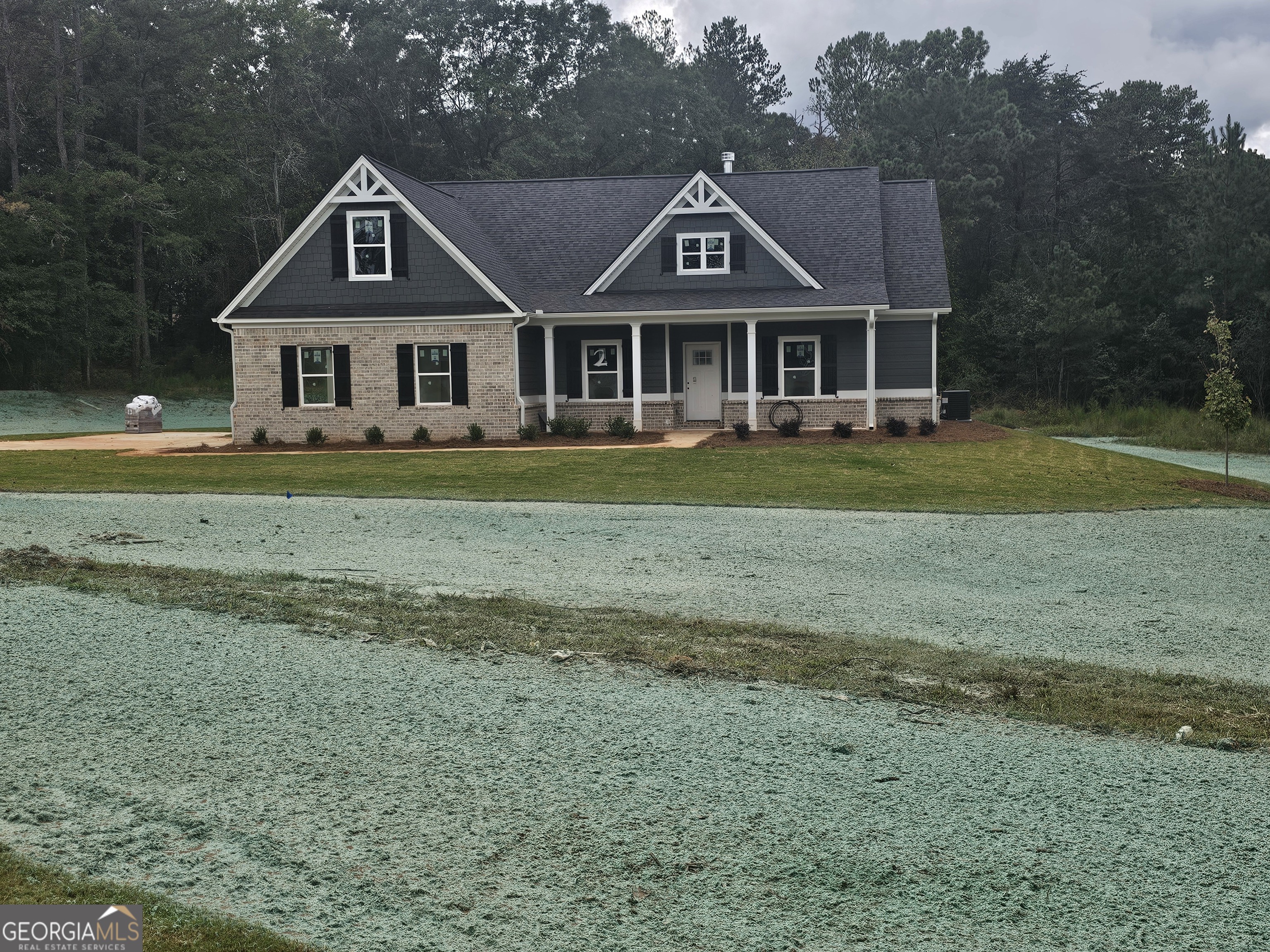 a front of a house with a garden