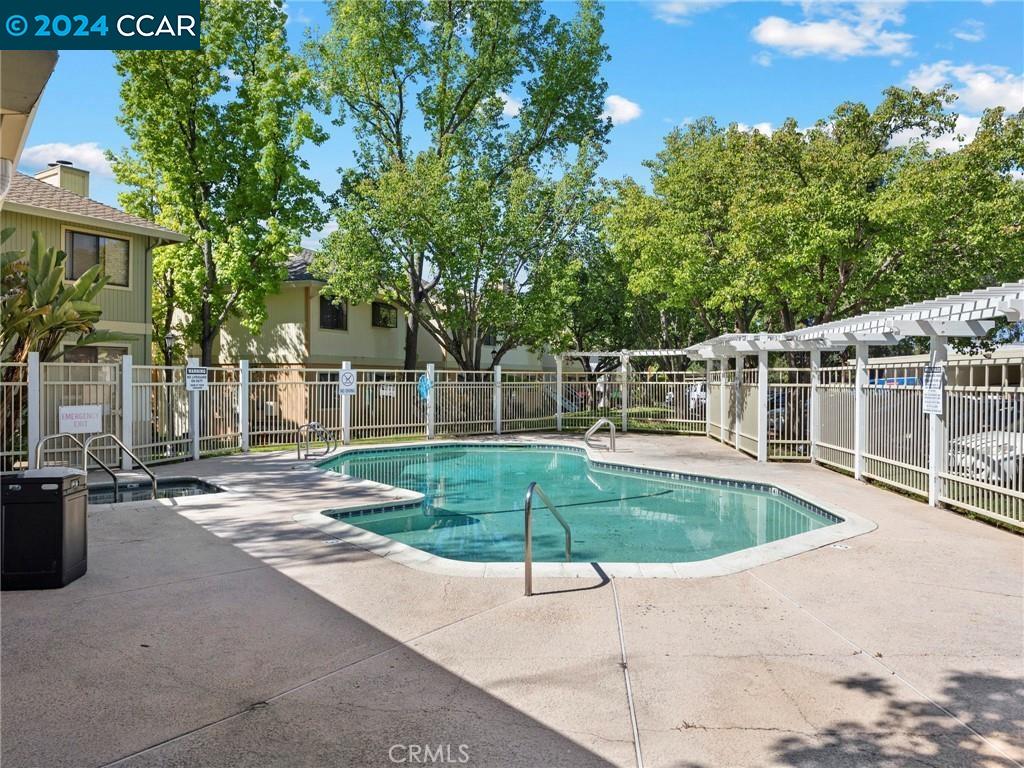 a view of a swimming pool with a patio