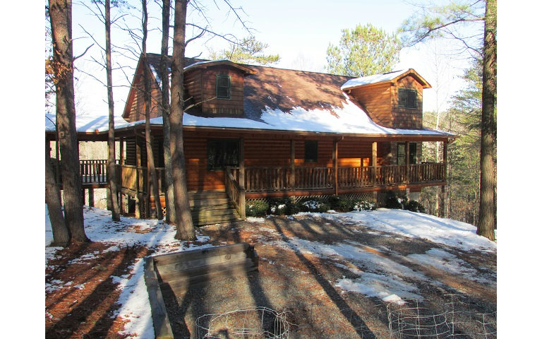 a view of a house with brick walls