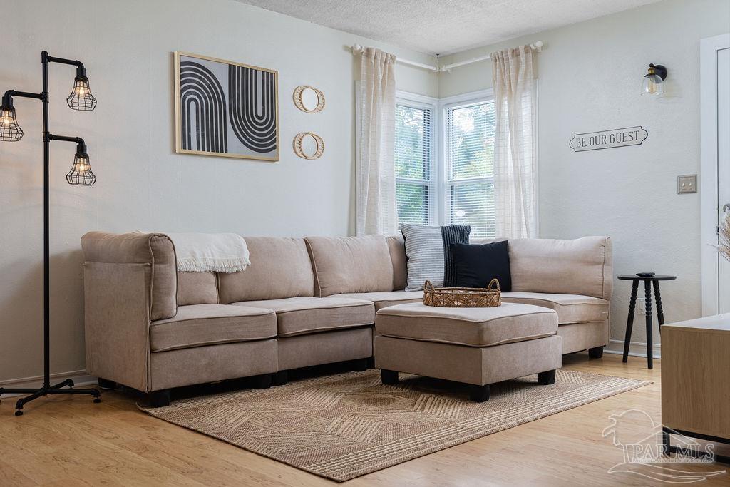 a living room with furniture and window